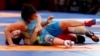 Indonesia-Wrestling - 2018 Asian Games – Women's Freestyle 53 kg Gold Medal Final - JCC – Assembly Hall - Jakarta, Indonesia – August 20, 2018 – Pak Yong Mi of North Korea in action with Zhuldyz Eshimova of Kazakhstan. REUTERS/Issei Kato