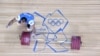 Kazakhstan's Ilya Ilyin celebrates during the men's 94kg group A weightlifting event of the London 2012 Olympic Games at The Excel Centre in London on August 4, 2012. AFP PHOTO / YURI CORTEZ (Photo by YURI CORTEZ / AFP)